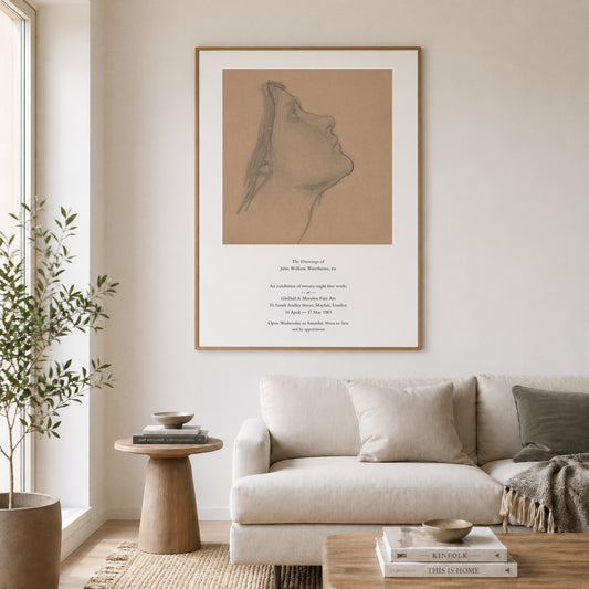 Living room with a beige sofa, wooden side table, and framed artwork on the wall.