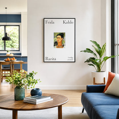 Living room with a framed Frida Kahlo poster on the wall, a blue sofa, wooden coffee table, and plants.
