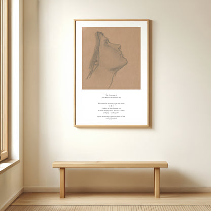 Framed artwork on a wall above a wooden bench in a room with a window.
