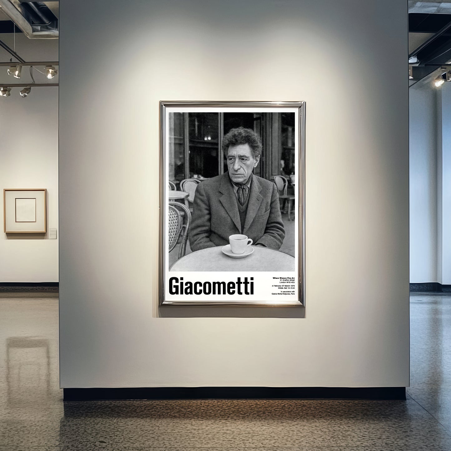 Framed black and white portrait of a man with 'Giacometti' text in an art gallery setting.