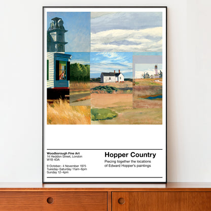 Framed artwork of a landscape with a lighthouse and houses, displayed on a wooden shelf.